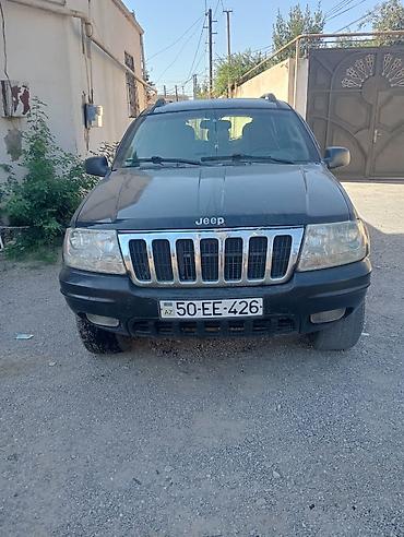 smart car: Jeep Grand Cherokee: 2.7 l | 2003 il Ofrouder/SUV — 1