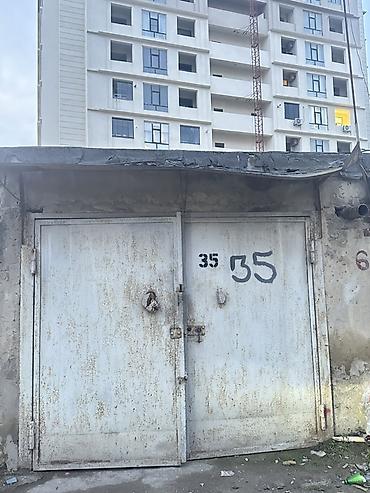 Yeni Günəşli qəsəbəsində Toyota hibrid servisin arxasında 31 saylı