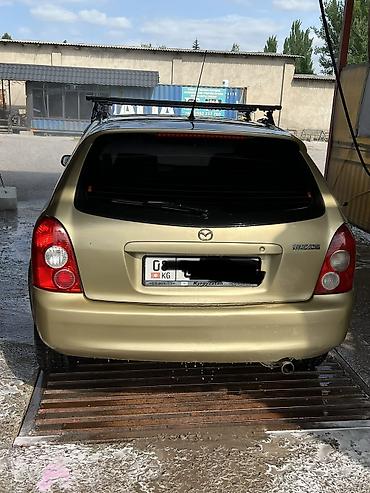 Mazda: Mazda 323: 2003 г., Бензин — 2