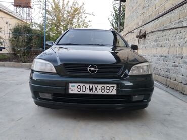 Opel: Opel Astra Caravan (universal) – tünd yaşıl rəng • Kuzov: universal — 3