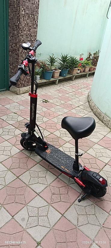 mikrafon şur: **KugooKirin M4 Pro+ elektrik skuter** Cəmi 17 km məsafə qət edib — 2