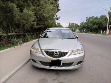 двигатель мазда 6 2.0 дизель купить: Серебристый седан Mazda Atenza оснащенный четырьмя дверями и