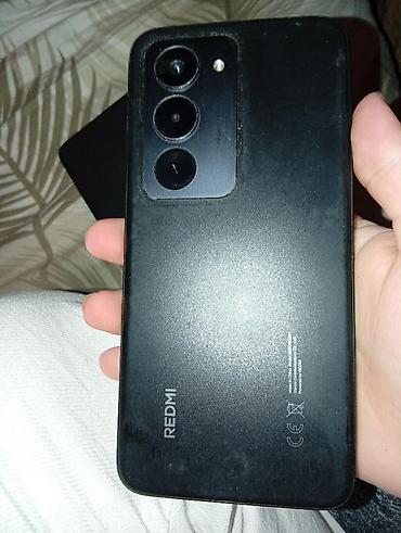 Xiaomi Redmi smartfon - Arxa panel: “REDMI” loqolu, mat qara gövdə -