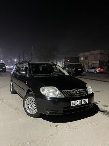крафтер пассажирский: Автомобиль Toyota Corolla в кузове универсал, черного цвета