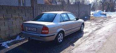 урунган машина: Mazda 323: 1999 г., 1.8 л, Механика, Бензин, Седан