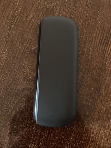 qara halile: IQOS elektron tütün qızdırıcısı, qara rəngdə, kompakt və zərif dizayna — 6