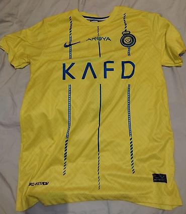 Kişi geyimləri: Al Nassr FK futbol köynəyi – “RONALDO 7” - Rəng: sarı, mavi detal və — 2