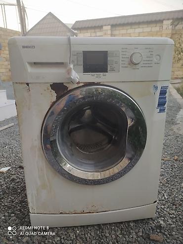 beko dispenser: Beko paltaryuyan maşın, ön yükləməli model. Üzərində görünən əsas — 1