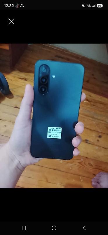 sony hdr sr5: Smartfon – qara rəngdə, mat arxa qapaqlı model. Arxada şaquli — 1
