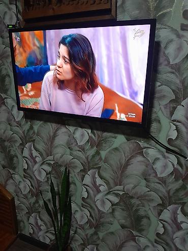 cekc tv: LED televizor, təxminən 32–40 düym diaqonallı, nazik çərçivəli model — 2