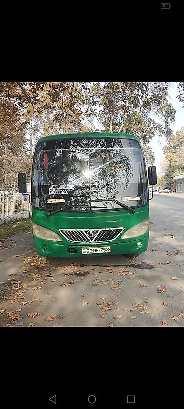 traktor farası: Yaşıl rəngli kiçik şəhər/marşrut avtobusu - Marka/model: Higer (kiçik — 1