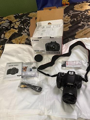 Фотоаппараты: Зеркальная камера Canon EOS 600D (Kit) Комплектация по фото: - Тушка — 2