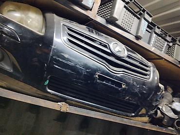 Передний бампер в сборе для Nissan Note (E11, дорестайлинг). Цвет —