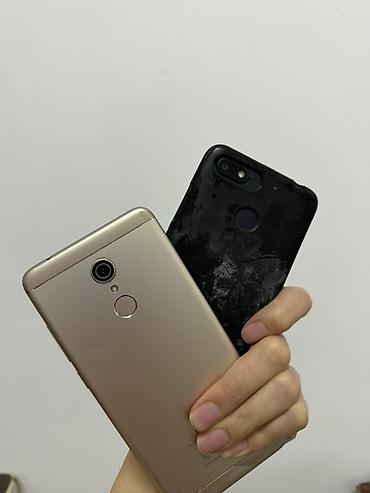 mi a4: Два смартфона Xiaomi (в паре): - Модель 1: корпус золотистого цвета — 2