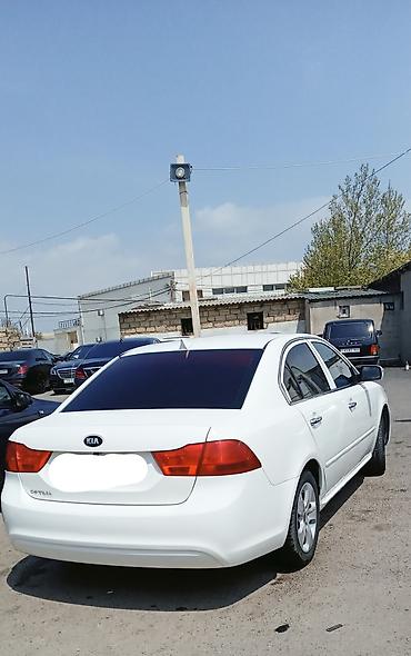 optima otracaqlar: Kia Optima sedan – ağ rəng, 4 qapı, ön‑çəkiş. 2008 ci il motor təzə — 5