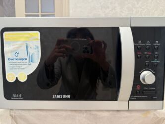 Кухонные плиты и варочные поверхности: Микроволновка Samsung, Отдельностоящая, С грилем, цвет - Серебристый