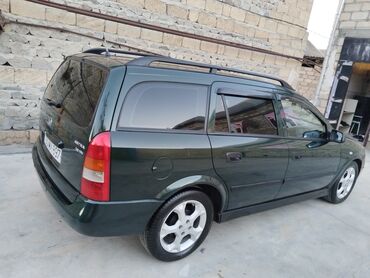 Opel: Opel Astra Caravan (universal) – tünd yaşıl rəng • Kuzov: universal — 9