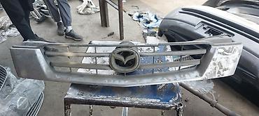 Решетки радиатора: Решетка радиатора Mazda Оригинал — 4