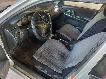mcv 21: Mazda Familia: 2002 г., 1.6 л, Механика, Бензин, Седан — 4