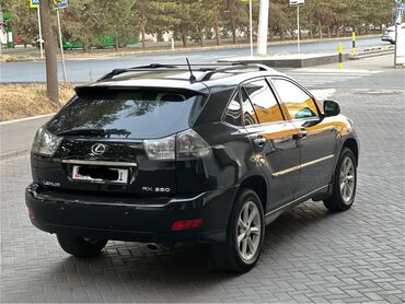 парктроники лексус: Черный кроссовер Lexus RX 330 с рейлингами на крыше и люком