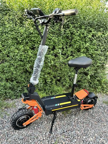 электрические скутер: Самокат Электрический Цвет: Черно-оранжевый Пробег на одном заряде