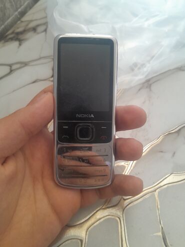 düyü bişirən: Nokia 6700 Slide, < 2 ГБ, цвет - Серый, Кнопочный