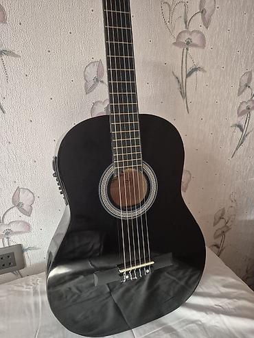 Классические гитары: WINZZ klassik gitara satılır, ölçüsü 4/4, qara rəngdədir. Gitara demək — 5