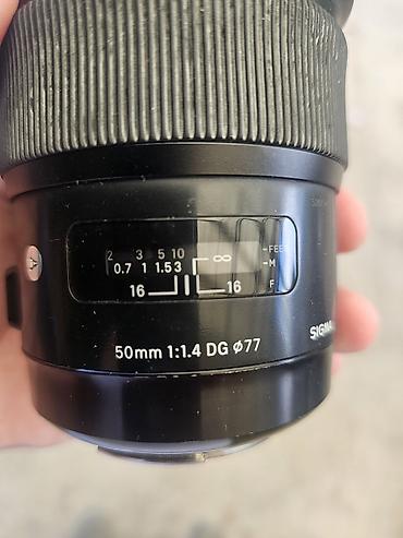 Объектив Sigma 50mm f/1.4 DG ART (диаметр фильтра 77 мм) -