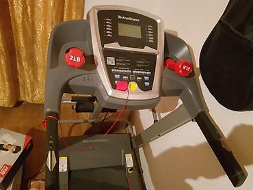 Беговые дорожки: Беговая дорожка Technofitness с консолью и программами тренировки — 2