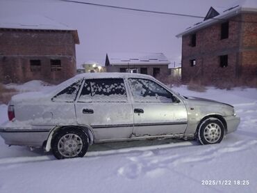 Daewoo: Модель DAEWOO NEXIA год выпуска TC 200 цвет белый (светло - серый)