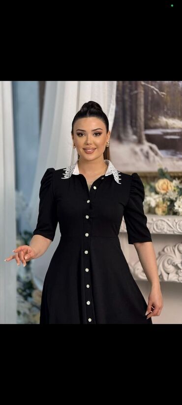 pencekler qadin ucun: Qadın paltarı – klassik qara rəngdə, dizdən aşağı uzunluqda A-kəsim