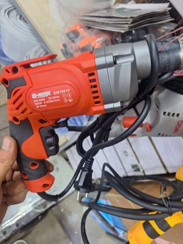 мотобур для столбов: Электродрель D-MAX DM10010, выполненная в оранжево-черном корпусе