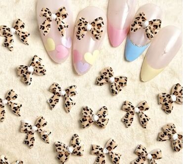 Nega noktiju: Set minijaturnih ukrasnih privesaka za nokte u obliku mašnica — 7