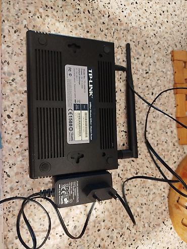 internet mademi: TP-LINK TD-W8961G simsiz ADSL2+ modem router. Model etiketində — 1