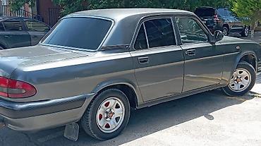 volga 2110: GAZ Volga 31105 sedan - Kuzov: 4 qapılı sedan, tünd boz rəng, xrom ön — 3