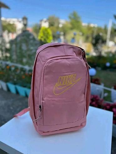 doca torbe: Rančevi sa štampom Nike motiva - Modeli: roze ranac sa žutim Nike — 1