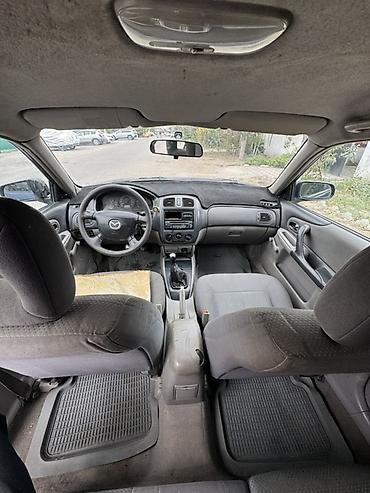 byd leopard 5: Mazda Familia: 2003 г., Универсал — 6
