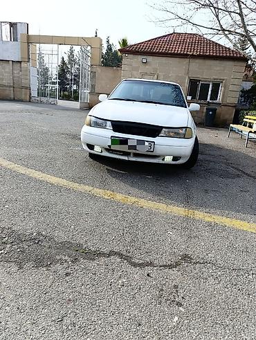Daewoo: Daewoo Nexia sedan, 4 qapı, ağ rəng. - Kuzov: kompakt sedan, ön — 1