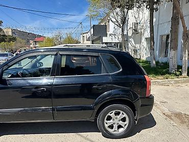 reduktor motor: Hyundai Tucson: 2 l | 2009 il Ofrouder/SUV — 5
