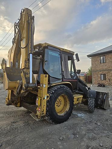 jcb 4cx: Погрузчик, Caterpillar, 2003 г., Колесный, Ковшовый — 2