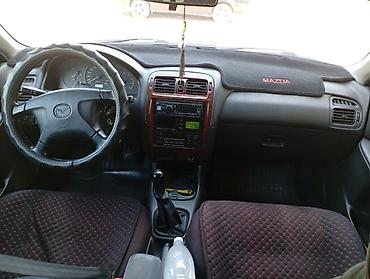 легкий карфакс: Mazda 626: 1998 г., 1.8 л, Механика, Бензин, Хэтчбэк — 5