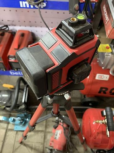 royce laser level: Лазерный нивелир на штативе. - Проецирует лазерные линии для разметки — 1