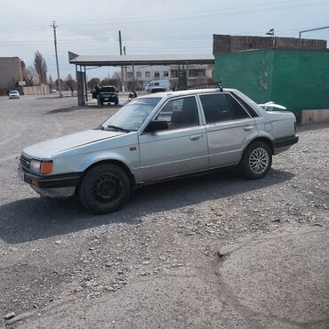 Транспорт: Mazda 323: 1986 г., 1.3 л, Механика, Бензин, Седан