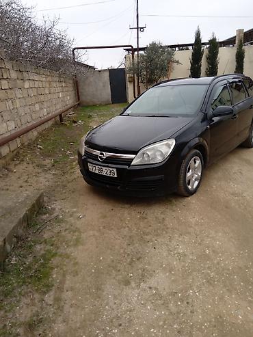 Opel: Opel Astra H Caravan (Universal) – qara rəng, salon və yük yeri geniş — 7
