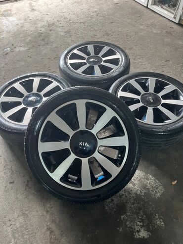 Шины: Kia optimanin zavod 18 lik diskiləri satilir tekerle birlikde satilir