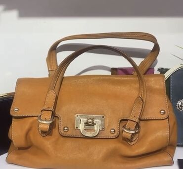 сумка бу кожа: DKNY 3500(оранжевая)б/у ТONNY HILFIGER 8000c Фиолетовая сумка бачок