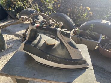 паровый утюк: Үтүк Буу, Вертикалдуу бууга кармап жумшартуу