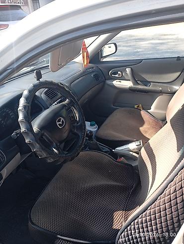 мазда демио шаравой: Mazda 323: 2003 г., 1.6 л, Механика, Бензин, Универсал — 4