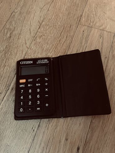 бтавой техника: Карманный калькулятор 
размер 7.5см на 10.5см