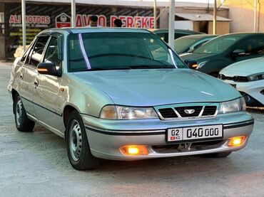 бампер шевроле спарк: Автомобиль Daewoo Nexia, представленный в серебристом цвете, является